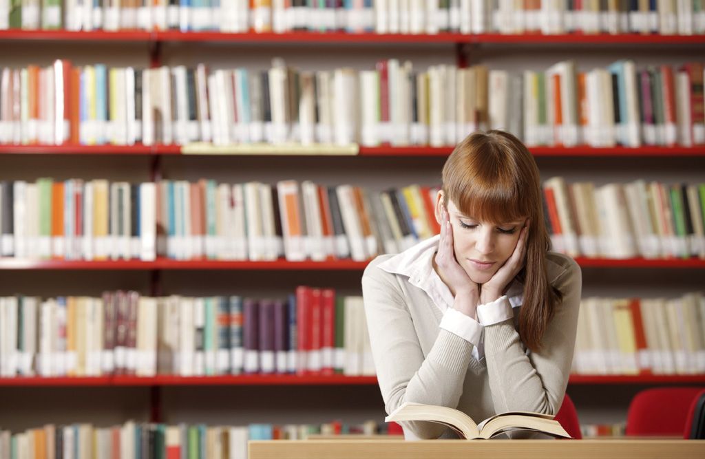 Girl reading at the library